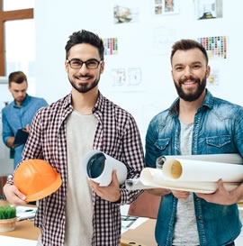 Engineers with technical documents